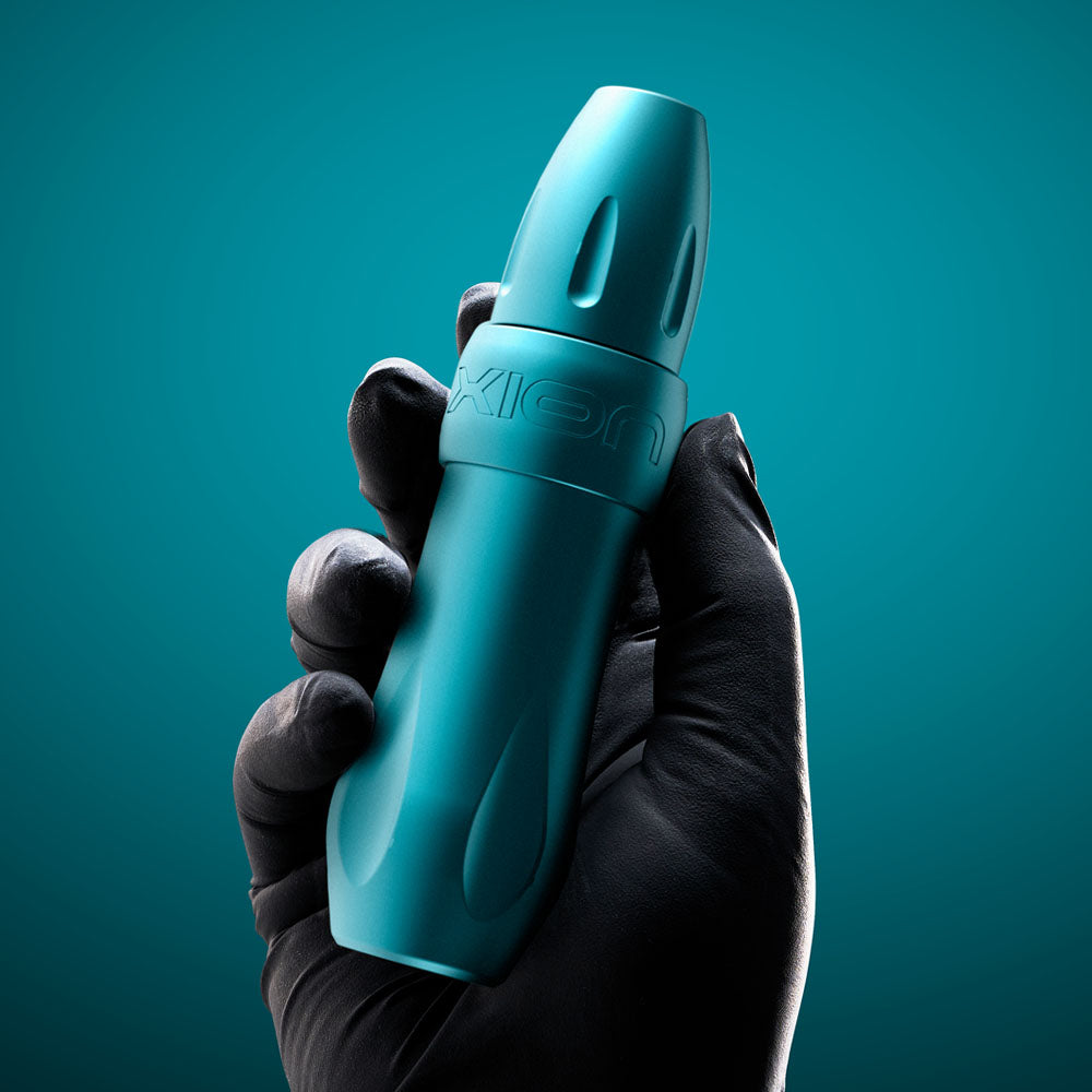 Spektra Xion Tidal modular tattoo machine held in artist's hand